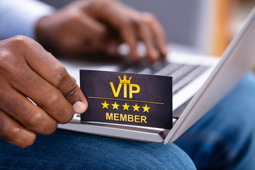 Close-up Of A Man's Hand Holding VIP Member Card