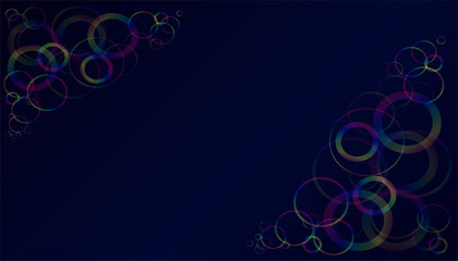 Multicolored translucent rings on a dark blue background.