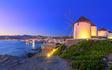 Mykonos port with boats and windmills at evening, Cyclades islands, Greece