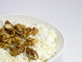cottage cheese with nuts on a white background