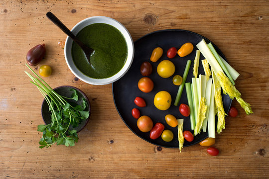 Overhead view of cilantro cumin dip with crudites