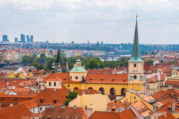 Obraz premium View over historic center of Prague with castle Prague city panorama, red roofs of Prague, Czech Republic