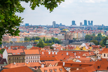 Obraz premium View over historic center of Prague with castle Prague city panorama, red roofs of Prague, Czech Republic