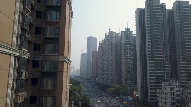 Guangzhou, China. Aerial shot of Congested living blocks and a highway with heavy traffic