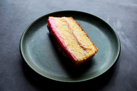 Close up of rhubarb vanilla pound cake slice served on plate 