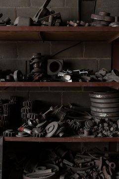 Unfinished metal castings arranged in rack