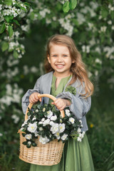 A happy young girl is carrying a basket of flowers 1818.