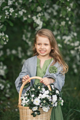 A happy young girl is carrying a basket of flowers 1819.