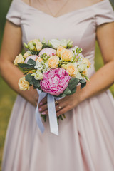 A bouquet of flowers in the hands of the bride 1821.