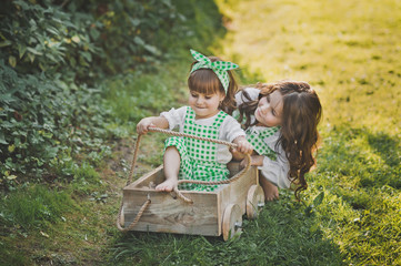 The sisters ride the berry cart 1881.