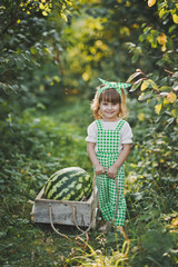 Portrait of a child with a huge watermelon in the cart 1889.
