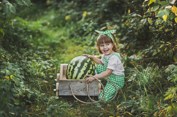 Portrait of a child with a huge watermelon in the cart 1892.
