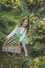 Portrait of a child with a huge watermelon in the cart 1894.