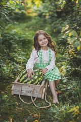 Portrait of a child with a huge watermelon in the cart 1895.