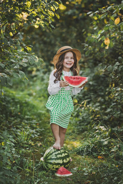 A happy child eats a juicy slice of watermelon 1896.