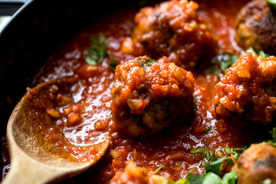 Close up of mackerel fish koftas in tomato and cardamom sauce
