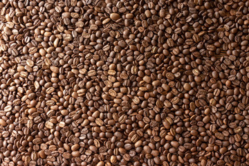 Coffee beans on the table background blurred abstract blurred