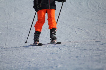 A ski athlete arrives at the end of the descent