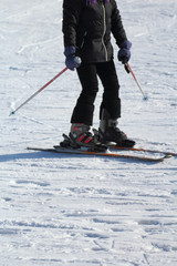 A ski athlete arrives at the end of the descent