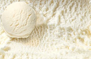 Strawberry  ice cream scoop on spooned ice cream background  
