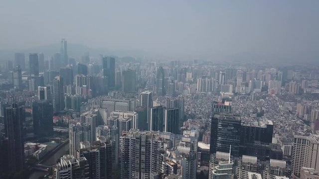 Guangzhou, China. Aerial shot of Tianhe district with congested living building blocks and office buildings.