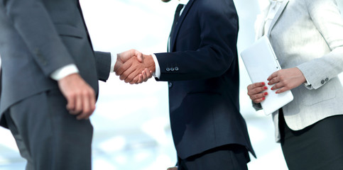 Business handshake and business people.