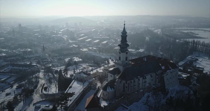 Flying around Nitra Castle back side in Winter, Aerial shot, Slovakia