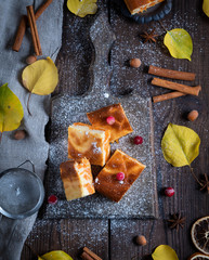 baked square pieces of pumpkin cheesecake