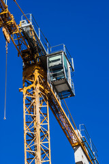 Construction crane againsta a clear blue sky - photography