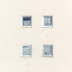 typical windows with curtains of an apartment house in Germany