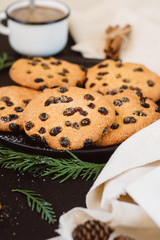Brown cookies in a dish on a dark background