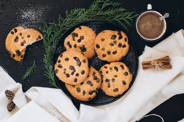 Brown cookies in a dish on a dark background