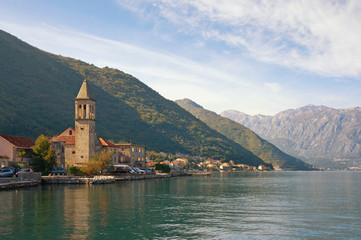 Fototapeta na wymiar Beautiful Mediterranean landscape. Montenegro, Adriatic Sea, Bay of Kotor. View of ancient town of Stoliv and Name of Mary Church
