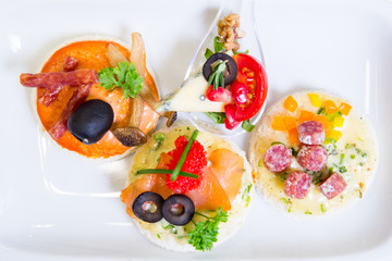 canape with fish, cheese and caviar