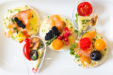 canape with fish, cheese and caviar