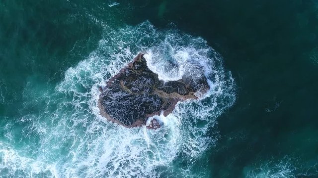 Aerial View from waves hitting Rock in Costa Rica at the Caribbean in Manzanillo