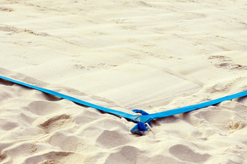 Close up chair referee in the playground on the volleyball beach. Boundaries of valleyball curt with blue lines. Background, place for text, copyspace