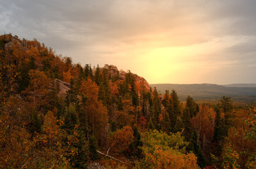 Fototapeta premium sunset in the mountains in the autumn forest