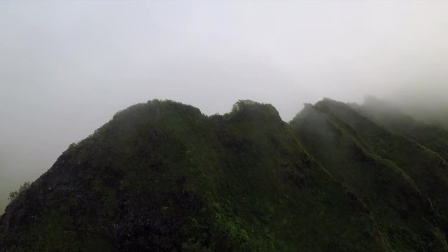 Clouds rush over the mountains near the Pali Lookout on Oahu, Hawaii.