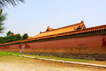 Red glazed tile eaves and wall, Eastern Tombs of the Qing Dynasty, China..
