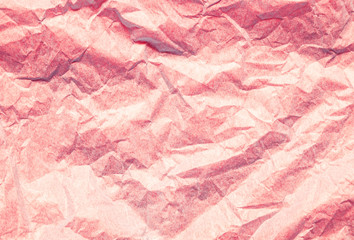 Pink red crumpled paper abstract background