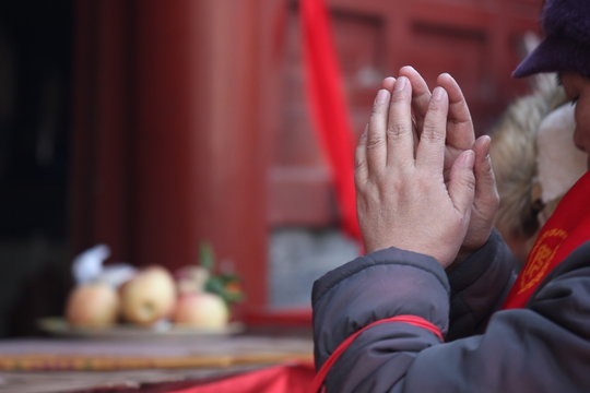 Praying hands in Beijing