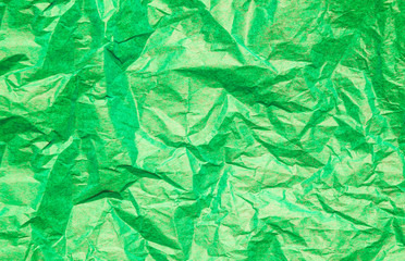 Green crumpled paper abstract background