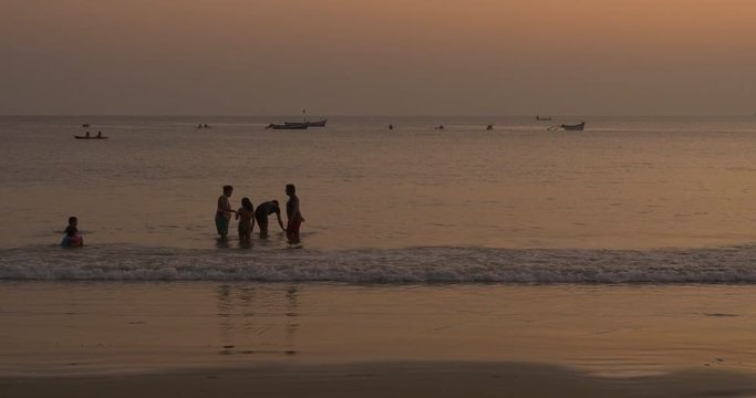 Foreign and Domestic Tourists Strolling, Bathing and Kayaking on Palolem Beach during Festive Season, Canacona, Goa, India