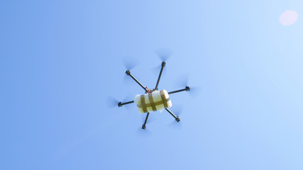 UAV drone flying with big drug stash, smuggling drug package across the border