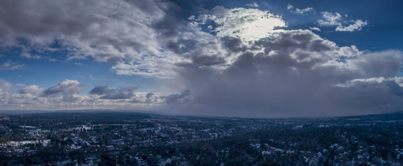 Aerial Panoramic View of Dramatic Snow filled Clouds