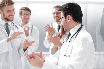 group of doctors applauding each other