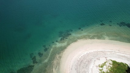 High angle view of different textures and colours of nature - sea, sand and trees