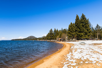 South Lake Tahoe shoreline and sandy beach, on a sunny day; California