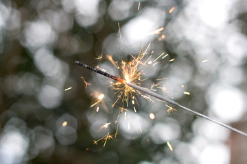 New Year's party sparkler with beautiful bokeh background. 
